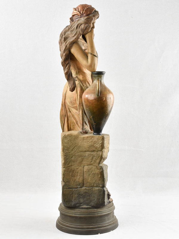 Pensive pose antique clay figurine