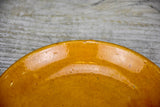 Set of seven mid-century plates with ocher glaze