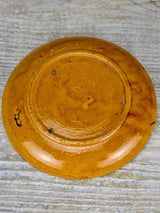 Set of seven mid-century plates with ocher glaze