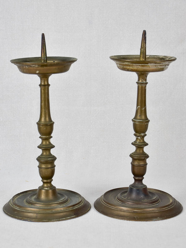Weighty historic bronze candlesticks
