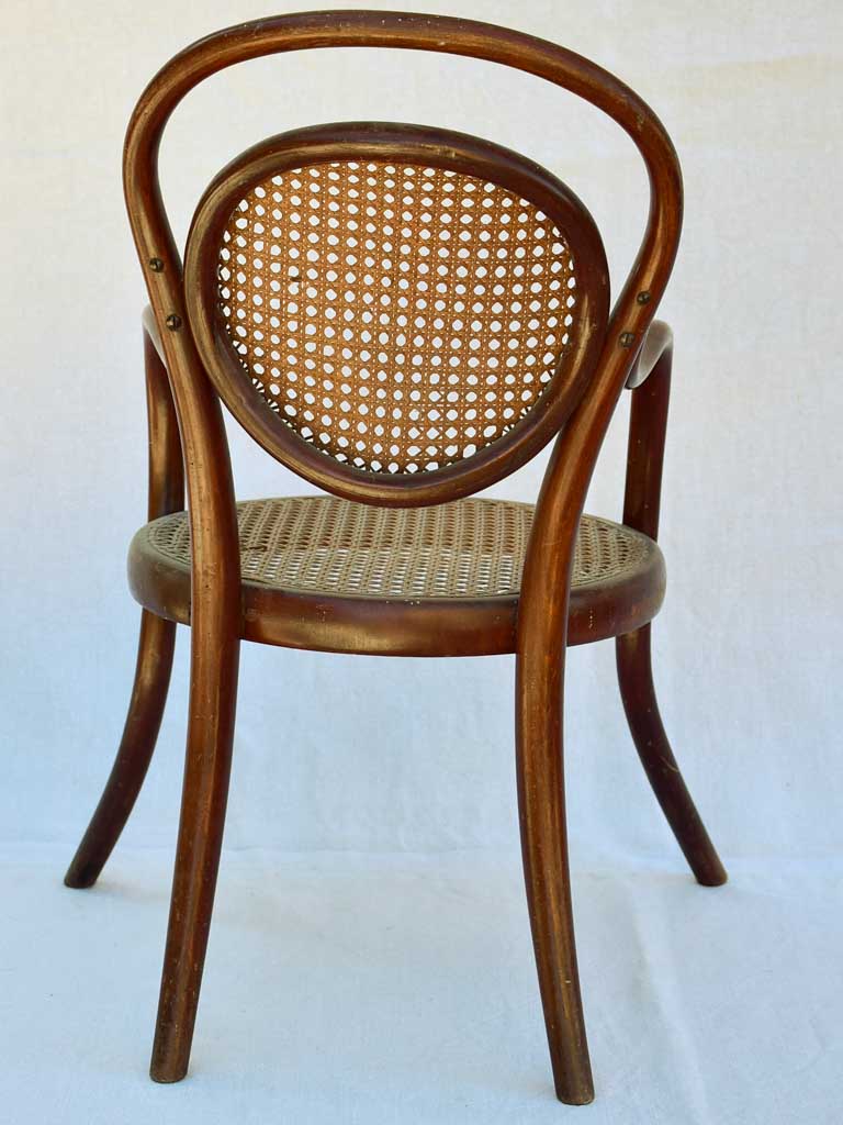Antique French children's bentwood and cane armchair