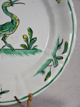 1950's Moustiers plate hand-painted with green foliage and a bird 9½"