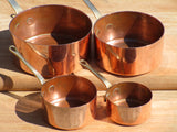 Set of four chefs miniature copper saucepans