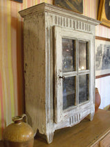 Side view of Rustic French provincial cabinet showcase with french door