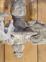 Detail of French lustre pendant light fitting with white washed patina