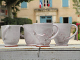 Set of four glazed ceramic cups