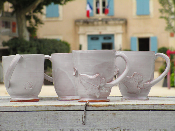 Set of four glazed ceramic cups