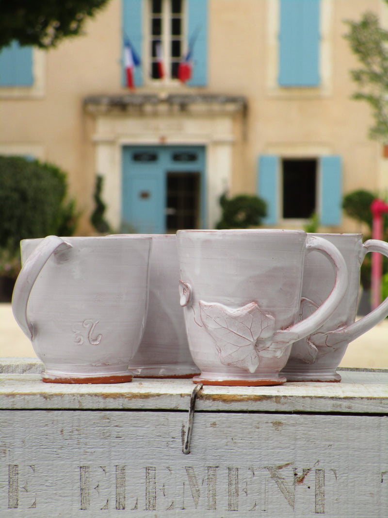 Set of four glazed ceramic cups