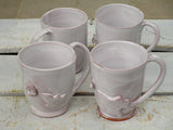 Set of four glazed ceramic cups