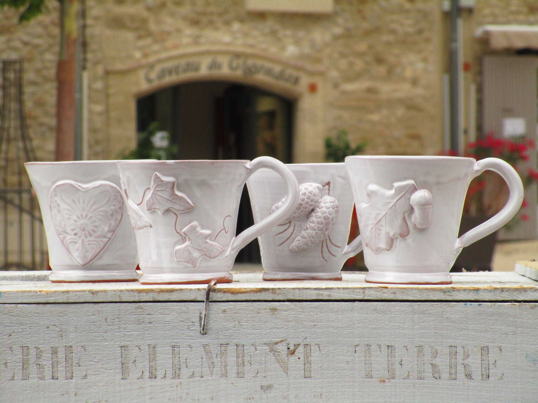 four glazed mugs bespoke french heart pinecone acorn vine