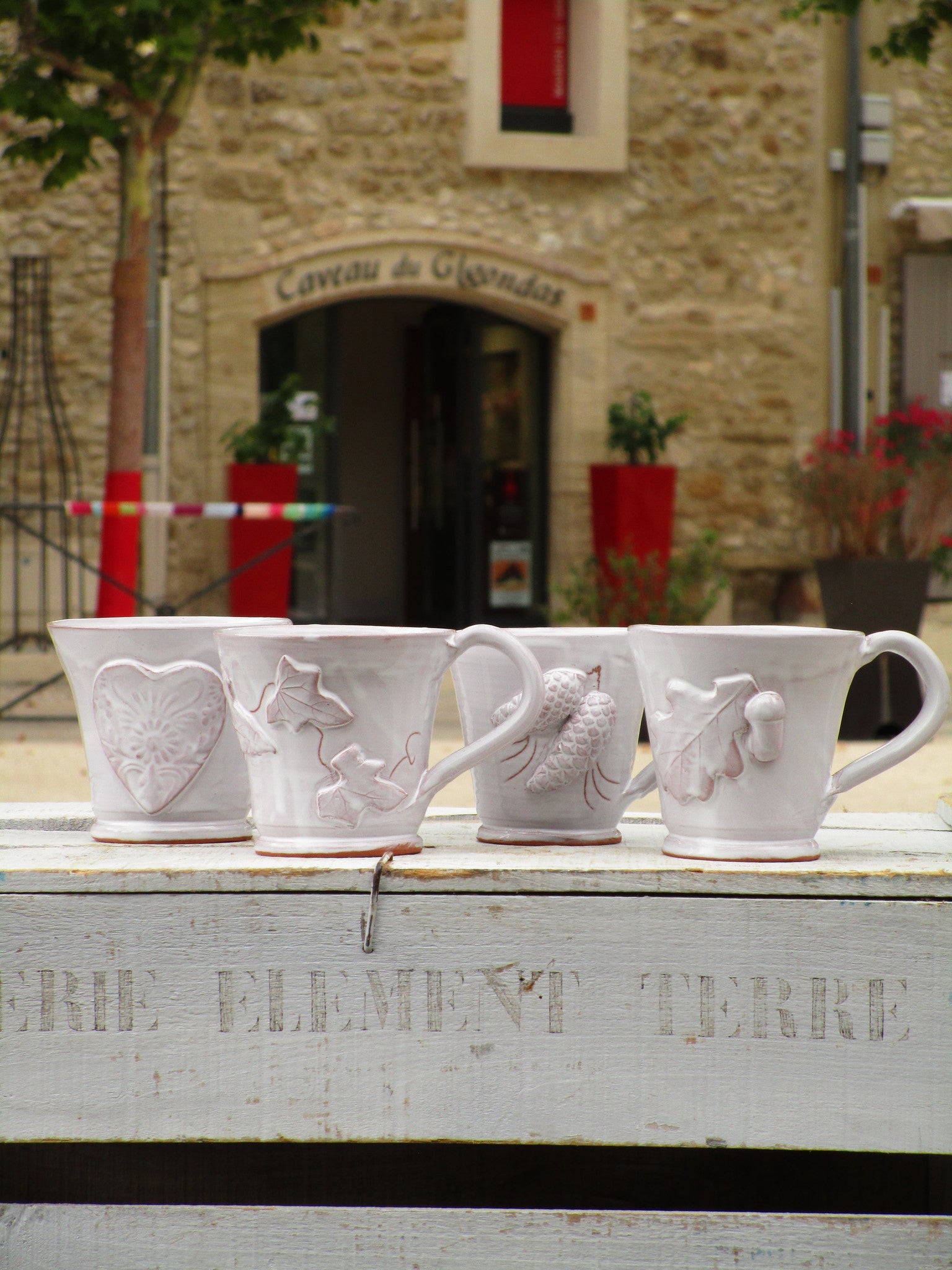 four glazed mugs bespoke french heart pinecone acorn vine