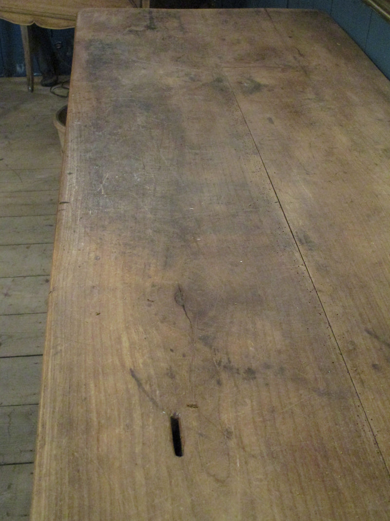coin slot detail on table top of rustic farmhouse kitchen island