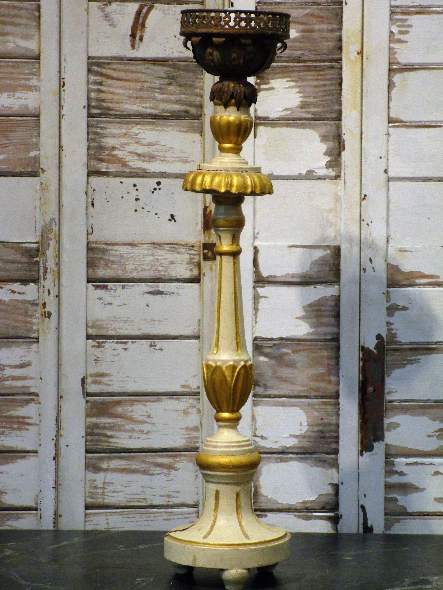 Antique carved candlestick with pineapple top