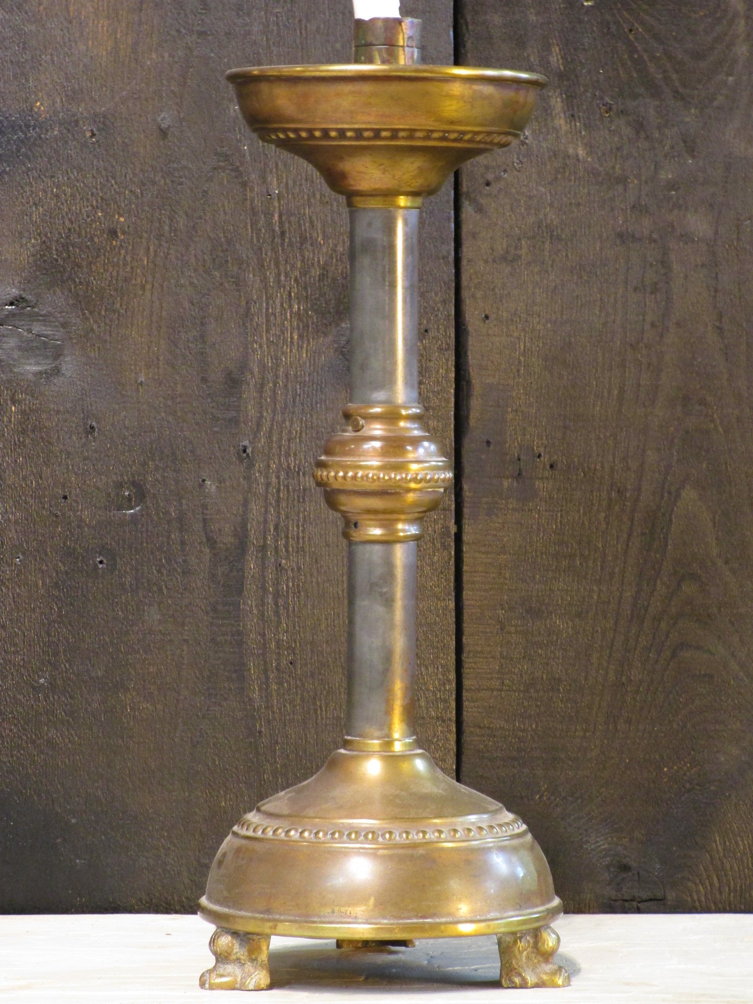 Antique French candlestick with bronze feet