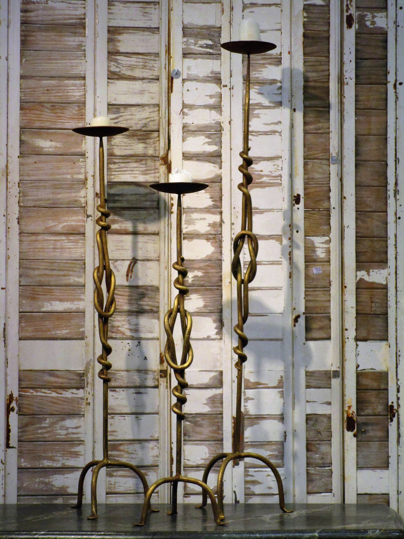 Set of three wrought iron candlesticks