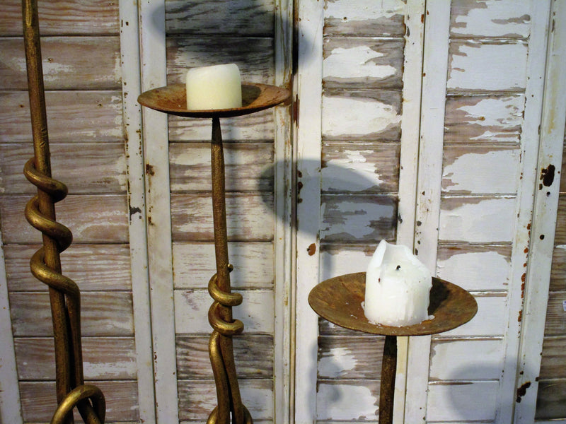 Set of three wrought iron candlesticks