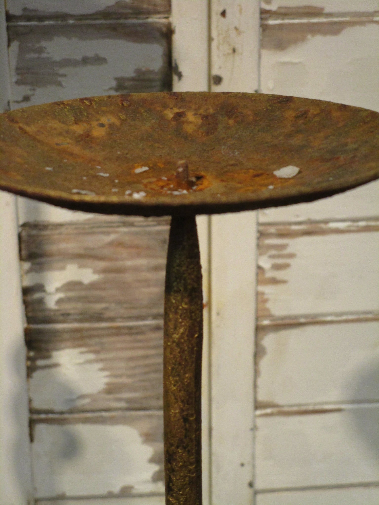 Set of three wrought iron candlesticks