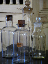 Set of four French glass apothecary jars