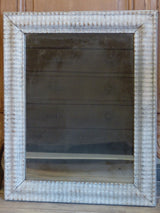 Rectangular mirror with rippled frame