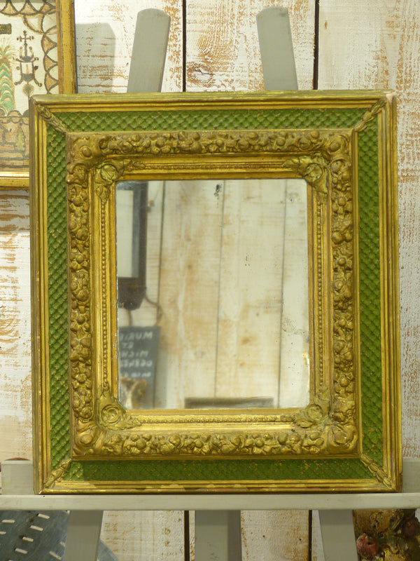 Small Napoleon III mirror with decorative green and gold frame