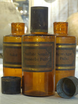 Set of three amber French Apothecary glass jars