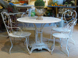 Round French garden table with 4 chairs – 1920’s