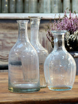 Set of three 19th and 20th century French glass bottles