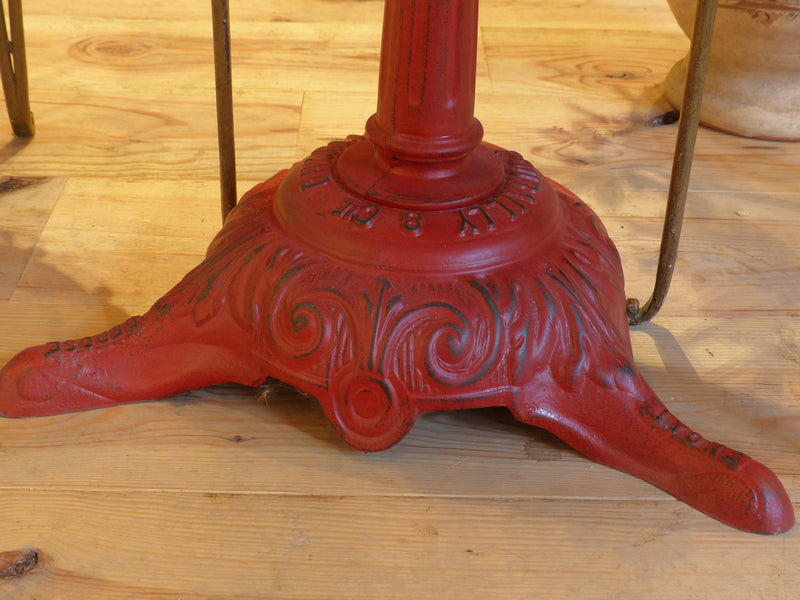 Round rose marble top bistro table with red stand