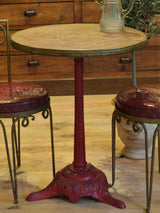 Round rose marble top bistro table with red stand