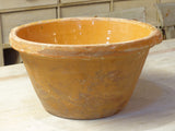 Rustic terracotta bowl with orange glaze