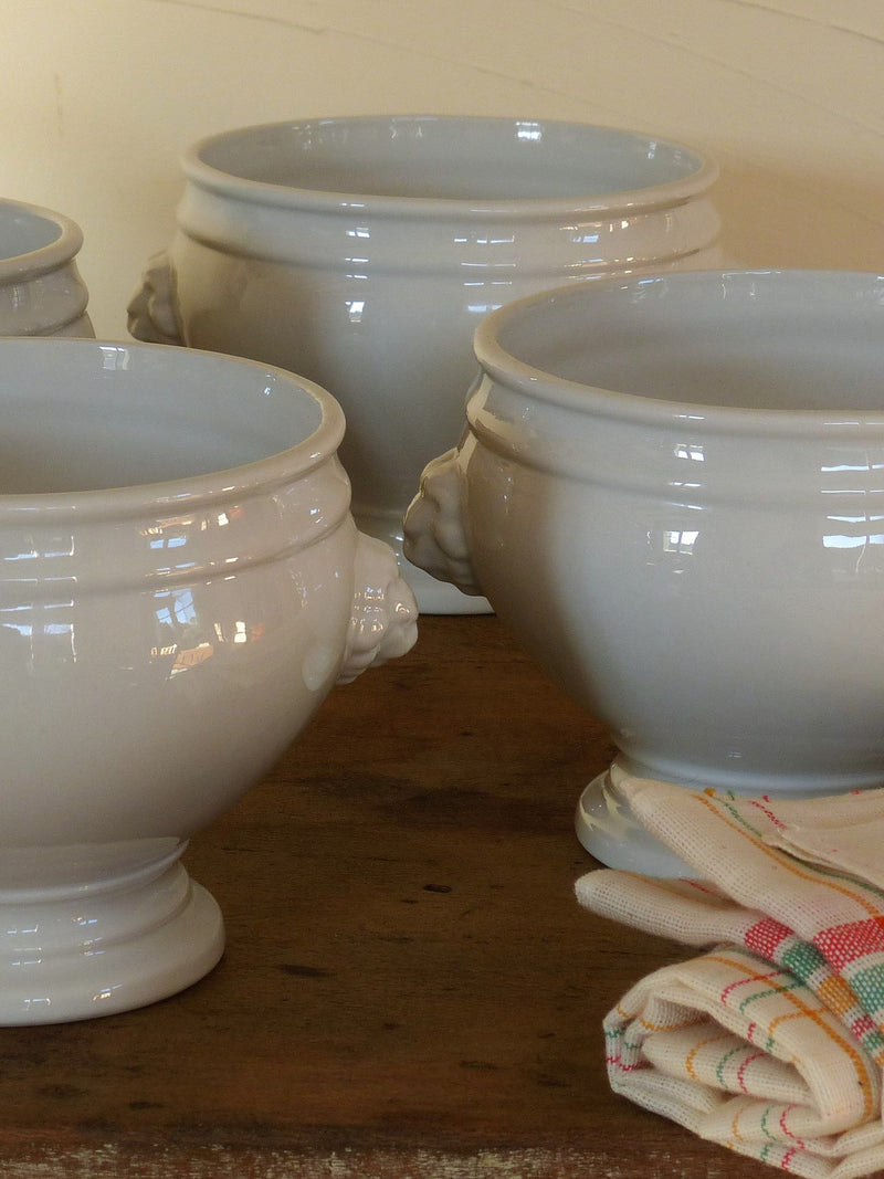 Set of four French lion head soup bowls