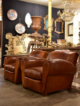 Pair of large vintage French club chairs with mustache back