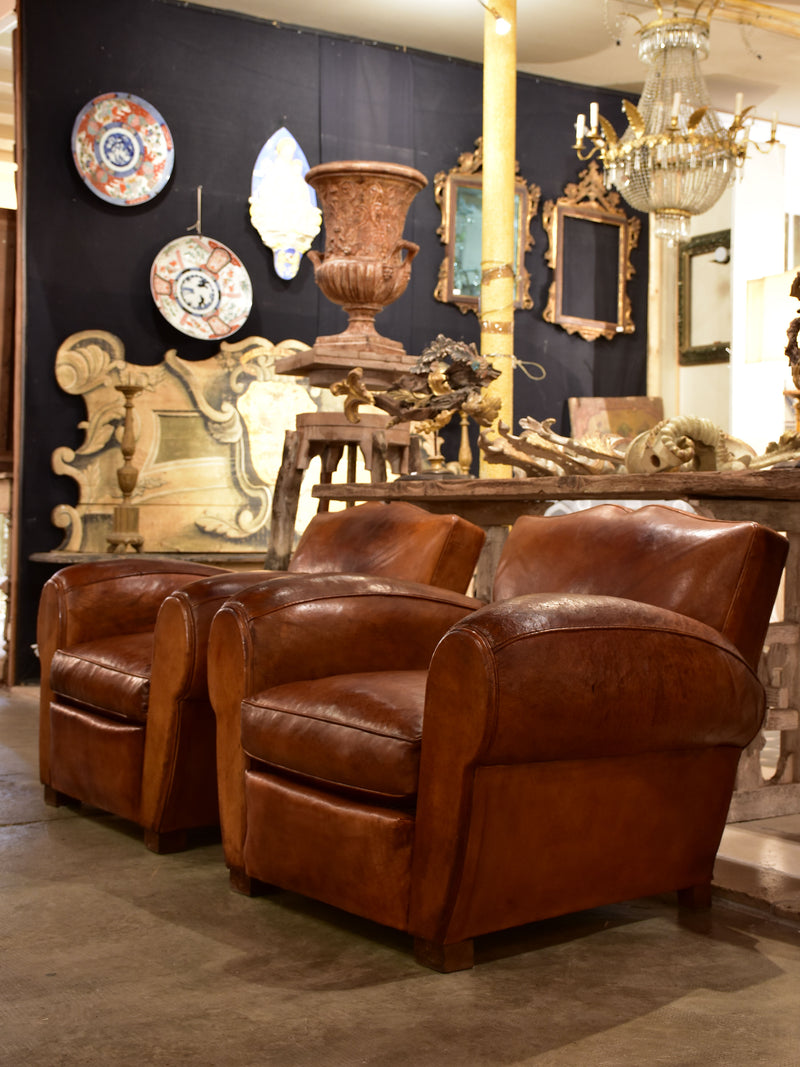Pair of large vintage French club chairs with mustache back