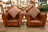 Pair of large vintage French club chairs with mustache back