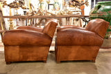 Pair of large vintage French club chairs with mustache back