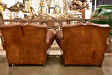 Pair of large vintage French club chairs with mustache back