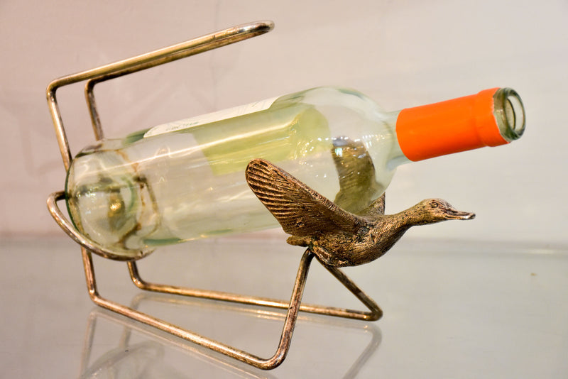 Vintage bottle stand with flying goose cradle