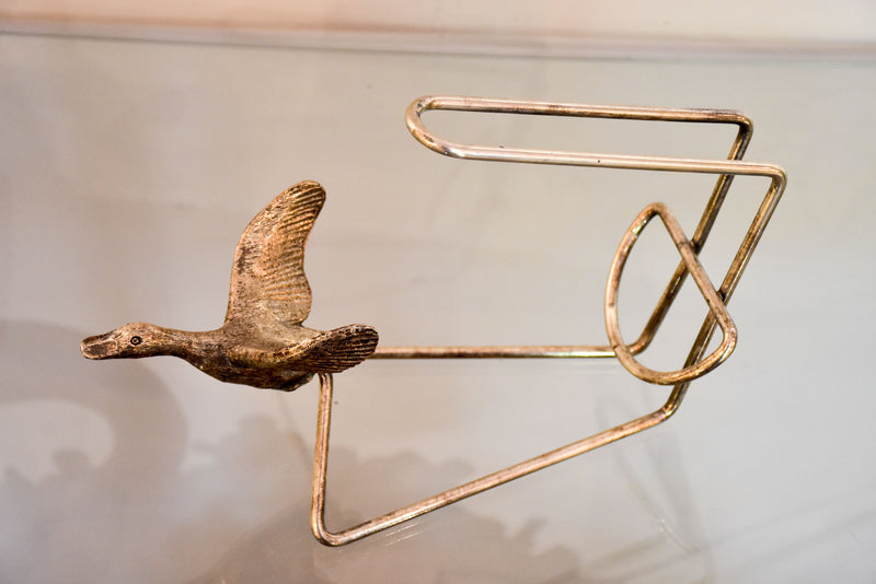 Vintage bottle stand with flying goose cradle